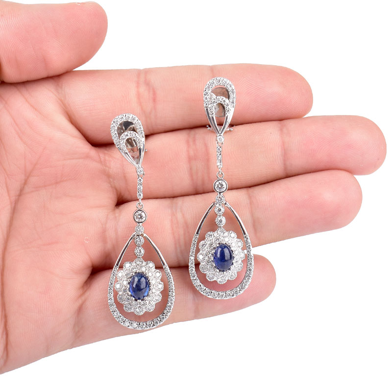 Approx. 2.0 Carat TW Oval Cabochon Sapphire, 2.50 Carat Round Brilliant Cut Diamond and 18 Karat White Gold Pendant Earrings.