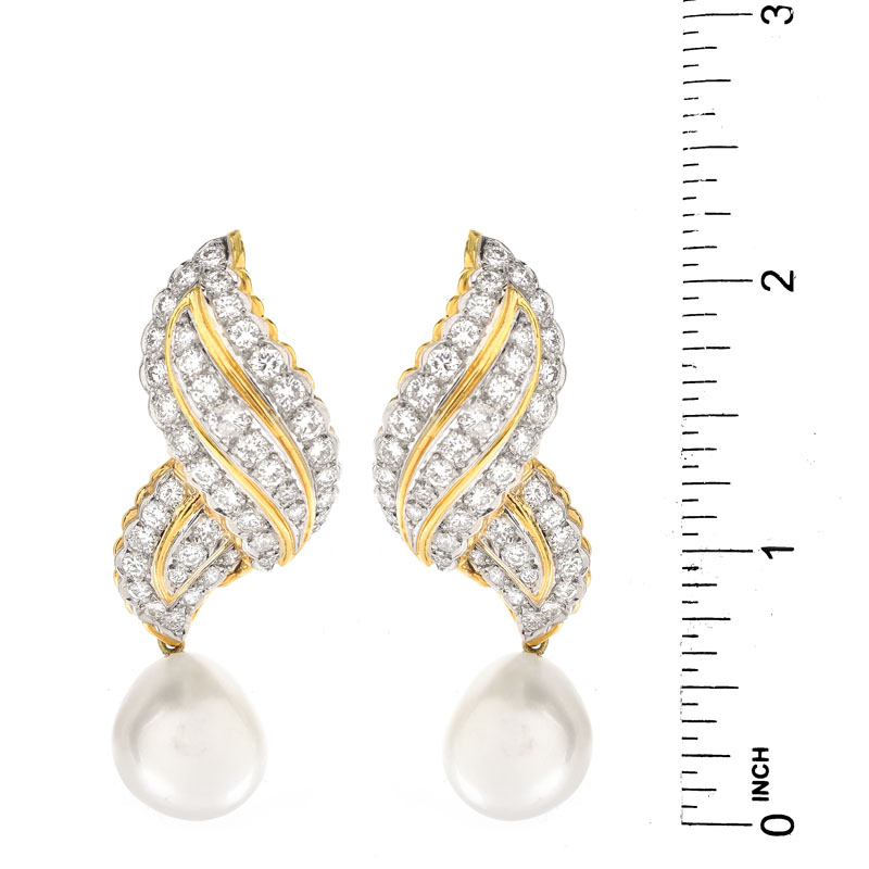 Approx. 5.50 Carat Round Brilliant Cut Diamond, Baroque Pearl and 18 Karat Yellow Gold Earrings. Diamonds F-G color, VS1-VS2 clarity.