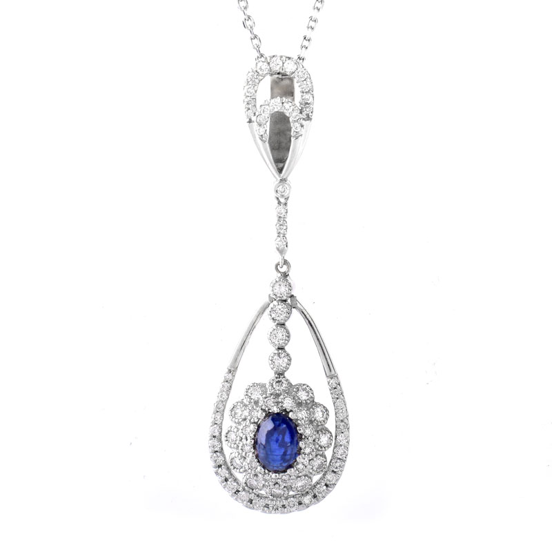 Approx. 1.0 Carat Oval Cabochon Sapphire, 1.25 Carat Round Brilliant Cut Diamond and 18 Karat White Gold Pendant with 14 Karat White Gold Necklace.