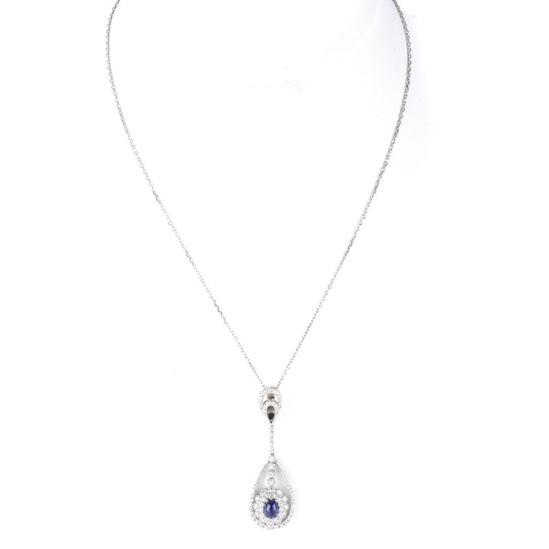 Approx. 1.0 Carat Oval Cabochon Sapphire, 1.25 Carat Round Brilliant Cut Diamond and 18 Karat White Gold Pendant with 14 Karat White Gold Necklace.