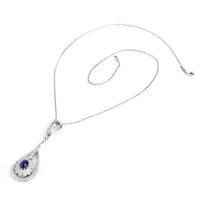 Approx. 1.0 Carat Oval Cabochon Sapphire, 1.25 Carat Round Brilliant Cut Diamond and 18 Karat White Gold Pendant with 14 Karat White Gold Necklace.