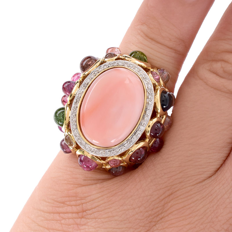 Vintage Angel Skin Coral, Cabochon Tourmaline,  Diamond and 14 Karat Yellow Gold Ring. Coral measures 19mm x 14mm.