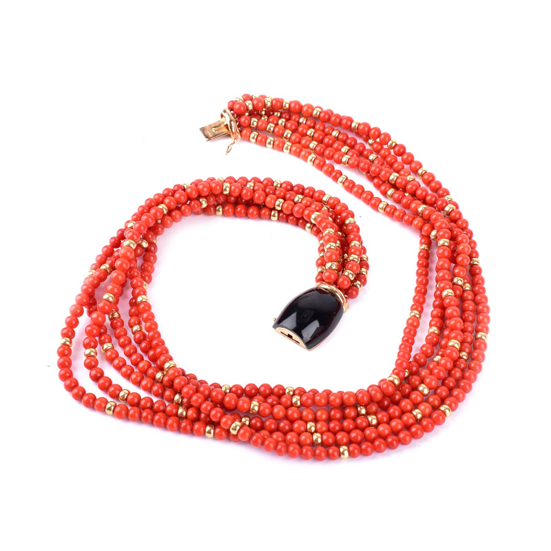 Vintage Red Coral and 14 Karat Yellow Gold Bead Multi Strand Necklace with Onyx and 14 Karat yellow Gold Clasp.