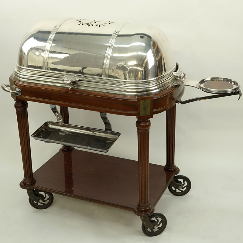 Large French Silver Plate and Carved Wood Meat Carving Trolley. Large vented dome top rolls back to reveal a removable plate and 3 sauce/gravy wells.