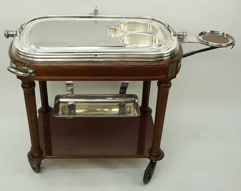 Large French Silver Plate and Carved Wood Meat Carving Trolley. Large vented dome top rolls back to reveal a removable plate and 3 sauce/gravy wells.