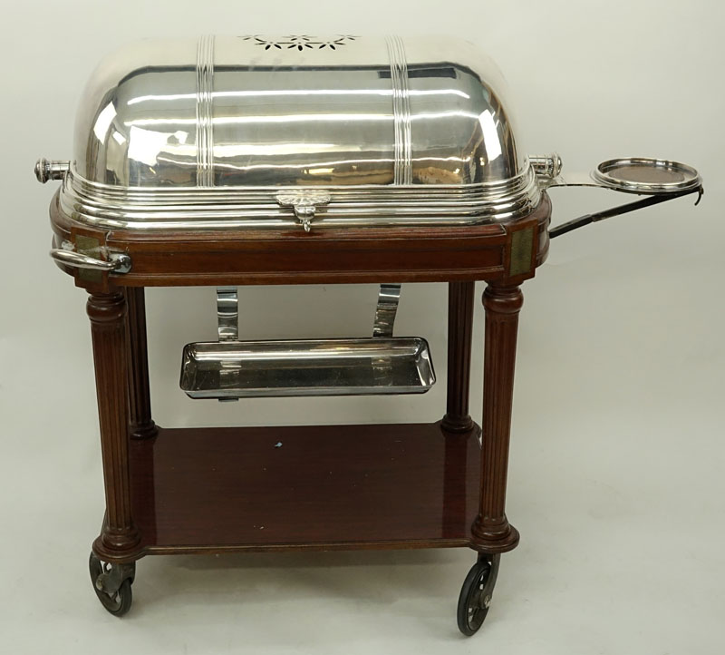 Large French Silver Plate and Carved Wood Meat Carving Trolley. Large vented dome top rolls back to reveal a removable plate and 3 sauce/gravy wells.