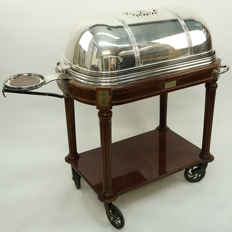 Large French Silver Plate and Carved Wood Meat Carving Trolley. Large vented dome top rolls back to reveal a removable plate and 3 sauce/gravy wells.