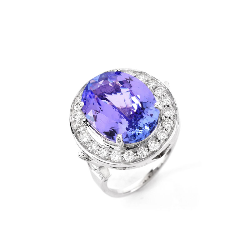 AIGL Certified 7.0 Carat Oval Cut Tanzanite, .70 Carat Diamond and 14 Karat White Gold Ring. 