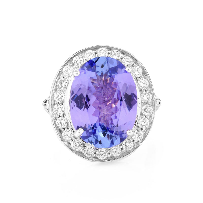 AIGL Certified 7.0 Carat Oval Cut Tanzanite, .70 Carat Diamond and 14 Karat White Gold Ring. 