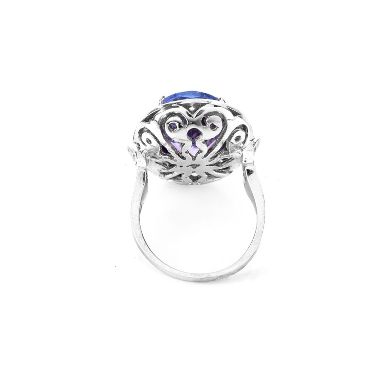 AIGL Certified 7.0 Carat Oval Cut Tanzanite, .70 Carat Diamond and 14 Karat White Gold Ring. 