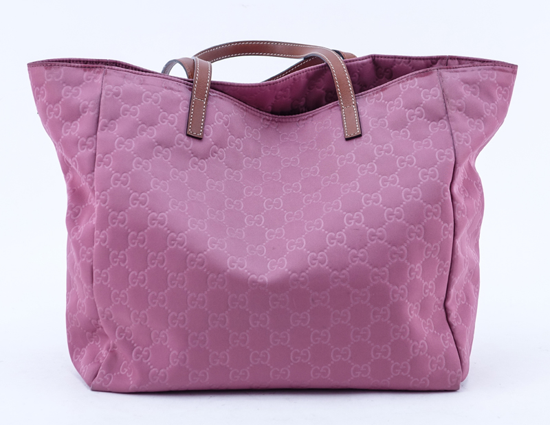 Gucci Pink Canvas Monogram Canvas Guccissima Tote. Brown leather straps. Natural canvas interior with zippered pocket.
