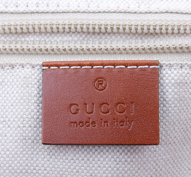 Gucci Pink Canvas Monogram Canvas Guccissima Tote. Brown leather straps. Natural canvas interior with zippered pocket.