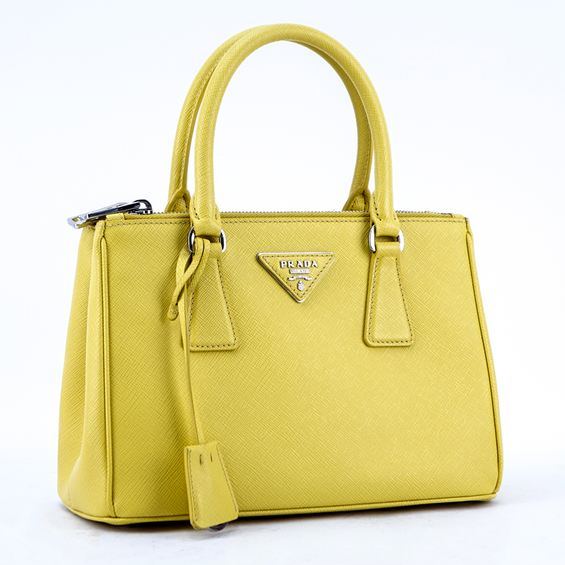 Prada Yellow Small Grained Leather Saffiano Lux Handbag.