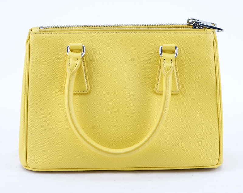 Prada Yellow Small Grained Leather Saffiano Lux Handbag.