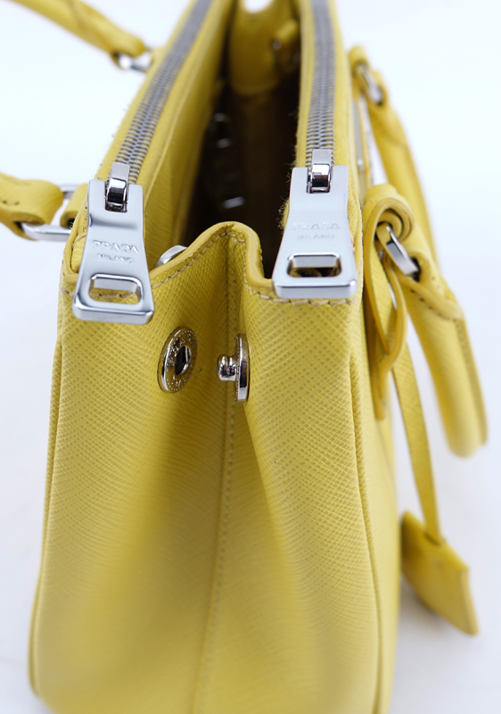 Prada Yellow Small Grained Leather Saffiano Lux Handbag.