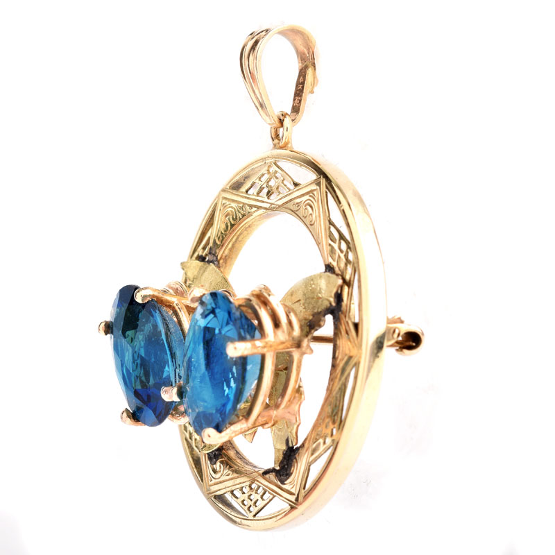 Vintage Oval Cut London Blue Topaz and 14 Karat Yellow Gold Butterfly Pendant / Brooch.