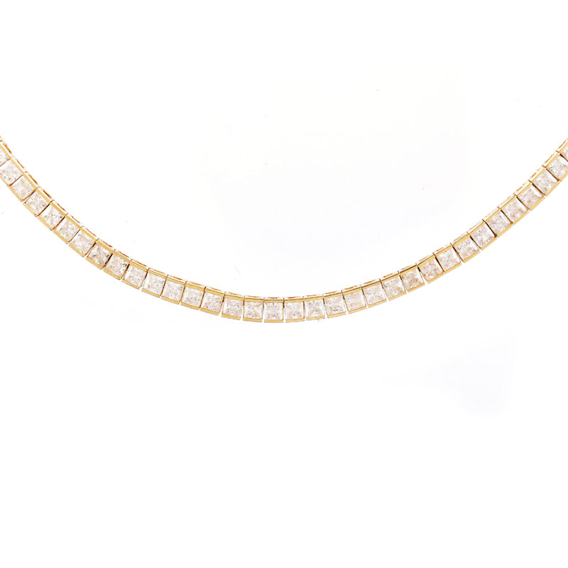 Contemporary 14 Karat Yellow Gold and Cubic Zirconia Group Including Necklace, Bracelet and Earrings.