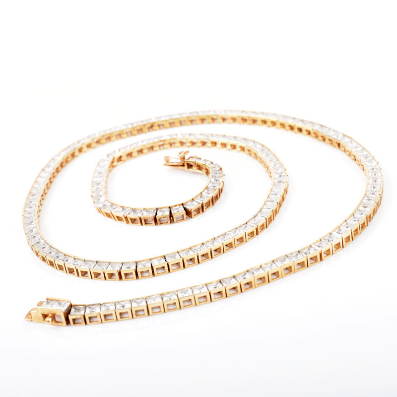 Contemporary 14 Karat Yellow Gold and Cubic Zirconia Group Including Necklace, Bracelet and Earrings.