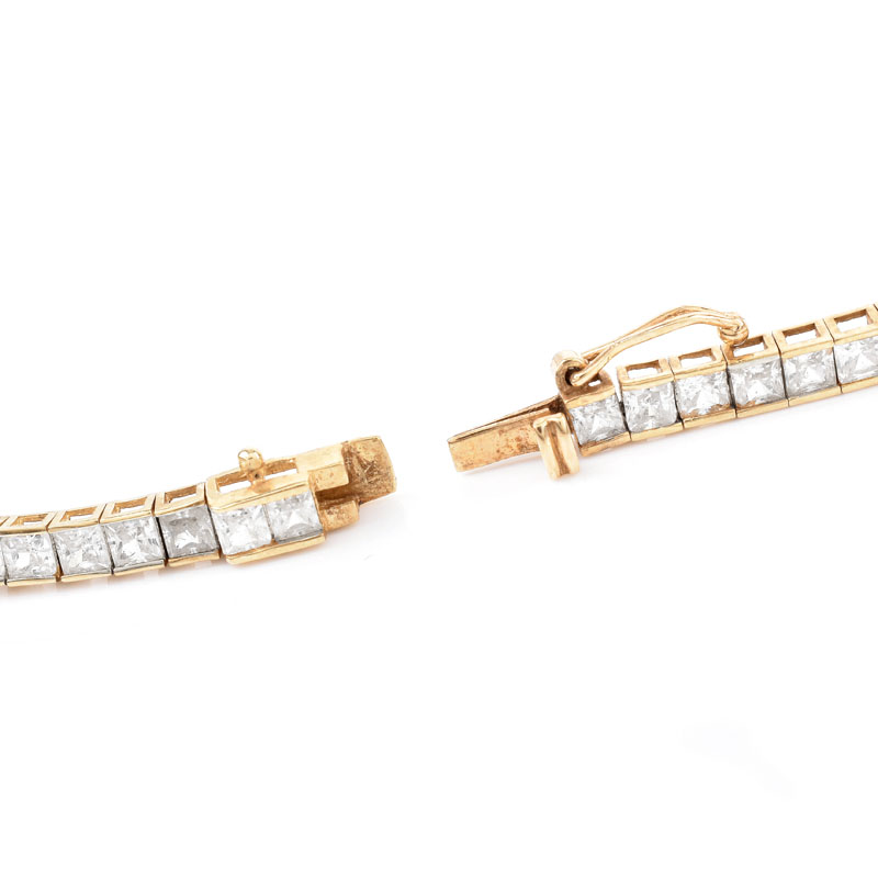 Contemporary 14 Karat Yellow Gold and Cubic Zirconia Group Including Necklace, Bracelet and Earrings.
