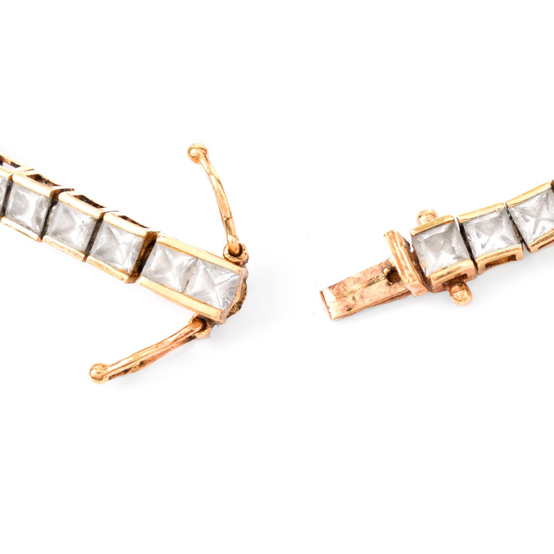 Contemporary 14 Karat Yellow Gold and Cubic Zirconia Group Including Necklace, Bracelet and Earrings.