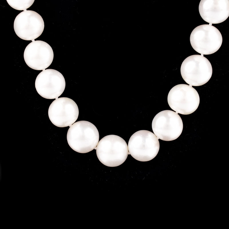 Single Strand Thirty Three (32) 12-14mm South Sea Pearl Necklace with 14 Karat White Gold and Diamond Clasp.