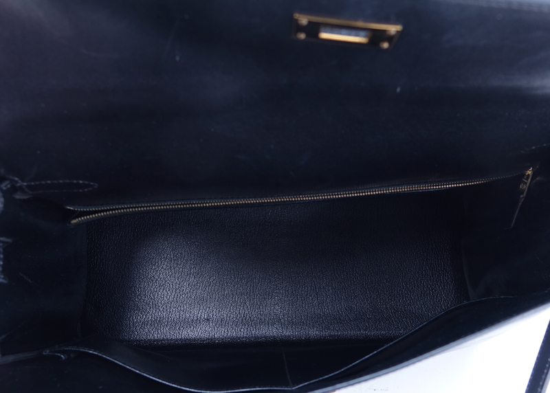 Hermes Black Kelly Retourne 35 Smooth Calf Leather Bag. Gold tone hardware. Leather interior with zipper pocket.