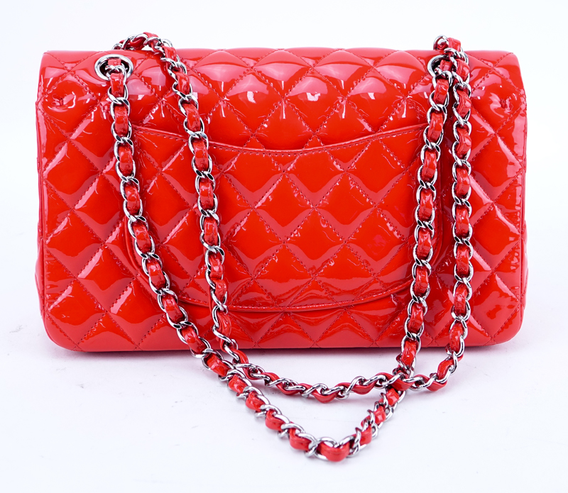 Chanel Red Quilted Patent Leather Classic Double Flap 26 Bag. Silver tone hardware, interior of red leather with zippered and patch pockets.