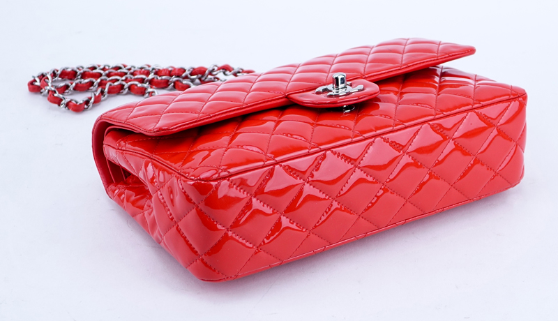 Chanel Red Quilted Patent Leather Classic Double Flap 26 Bag. Silver tone hardware, interior of red leather with zippered and patch pockets.