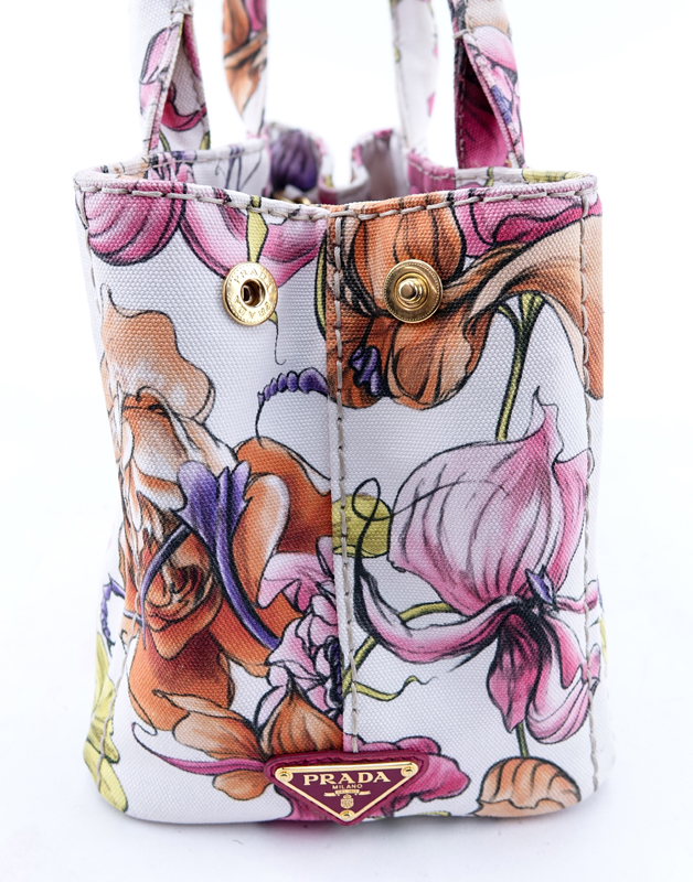 Prada Multi-Colored Floral Motif Canvas Canapa Mini Tote. Gold tone hardware, interior of pink canvas with zippered and patch pockets.