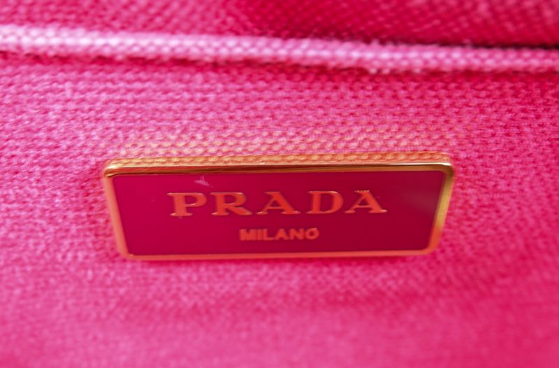 Prada Multi-Colored Floral Motif Canvas Canapa Mini Tote. Gold tone hardware, interior of pink canvas with zippered and patch pockets.