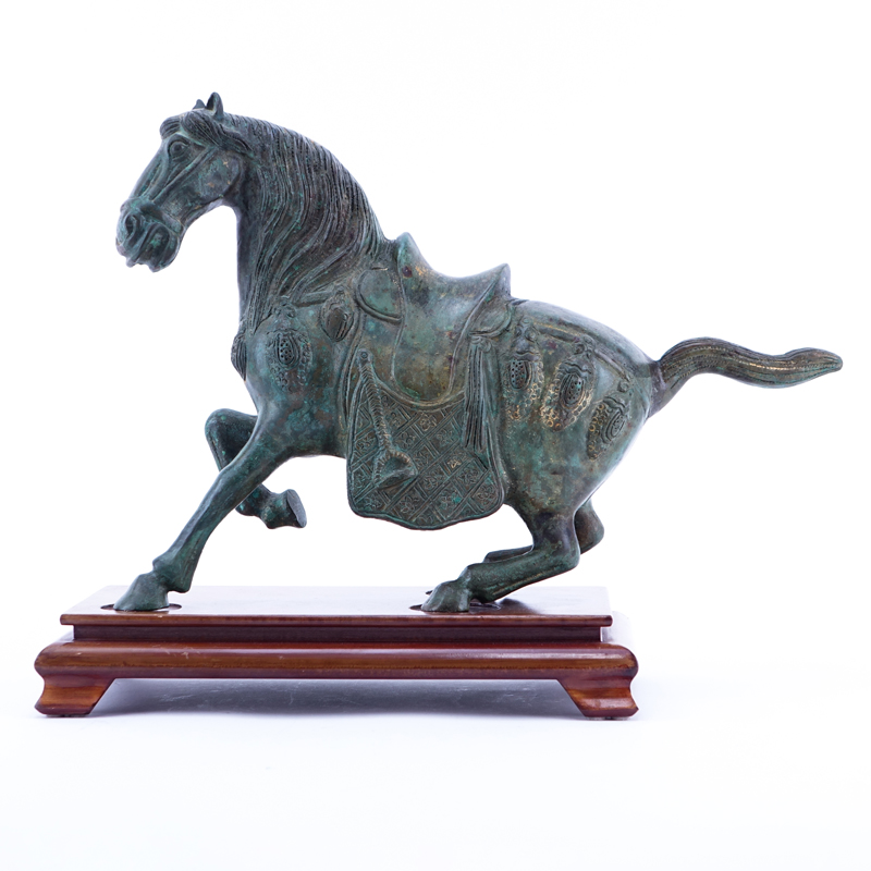 Chinese Tang Dynasty Style Patinated Bronze Model of a Horse on Wooden Stand.