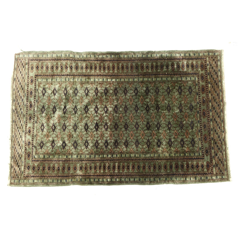 Semi Antique Green Bokhara Rug.