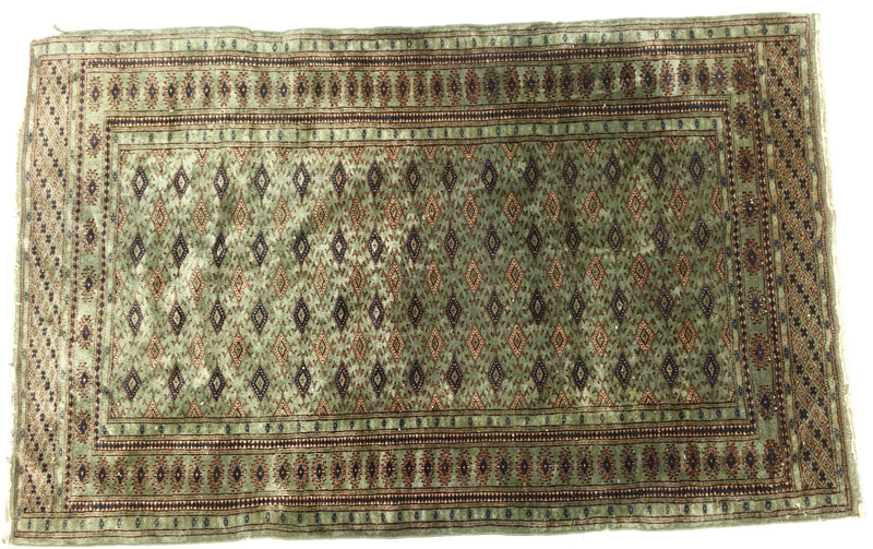 Semi Antique Green Bokhara Rug.