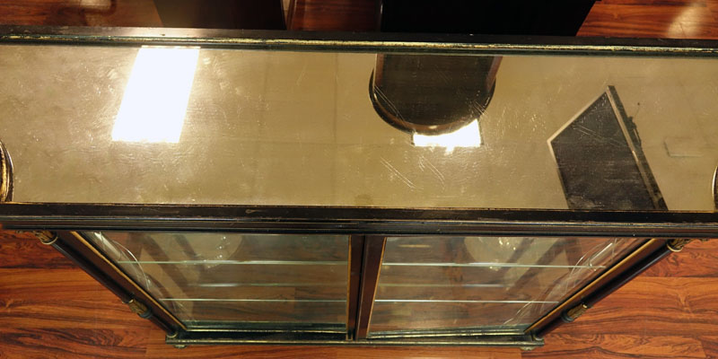 Early to Mid 20th Century English Regency Style Ebonized and Gilt Painted Two Door Credenza with Mirrored Top.