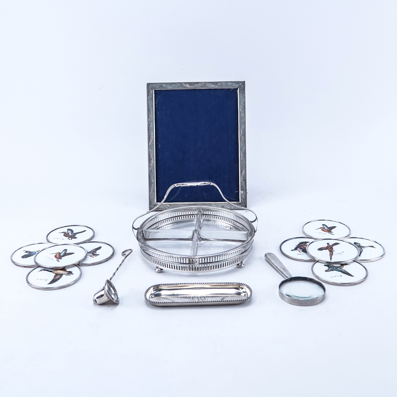 Grouping of Fifteen (15): Sterling Silver Divided Dish with Associated Glass Insert, Sterling Dish, 800 Silver Picture Frame, Sterling Candle Snuff, Sterling Magnifying Glass, and Ten Sterling Rimmed Coasters.