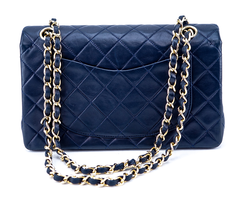 Chanel Navy Blue Quilted Leather Classic Double Flap Bag 23. Gold tone hardware, interior of burgundy leather with patch pockets.