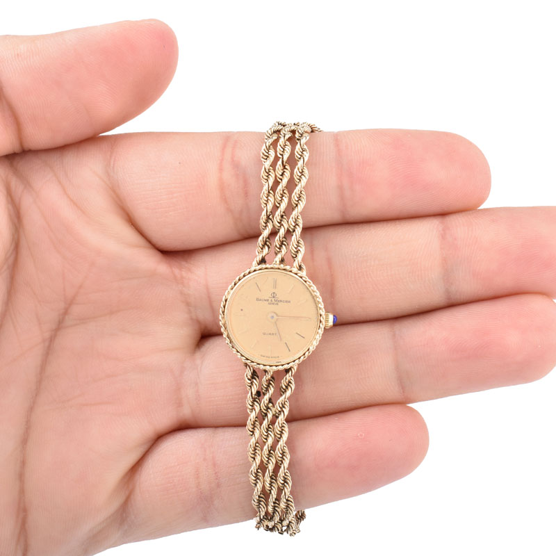 Lady's Vintage Baume & Mercier 14 Karat Yellow Gold Bracelet Watch with Quartz Movement.