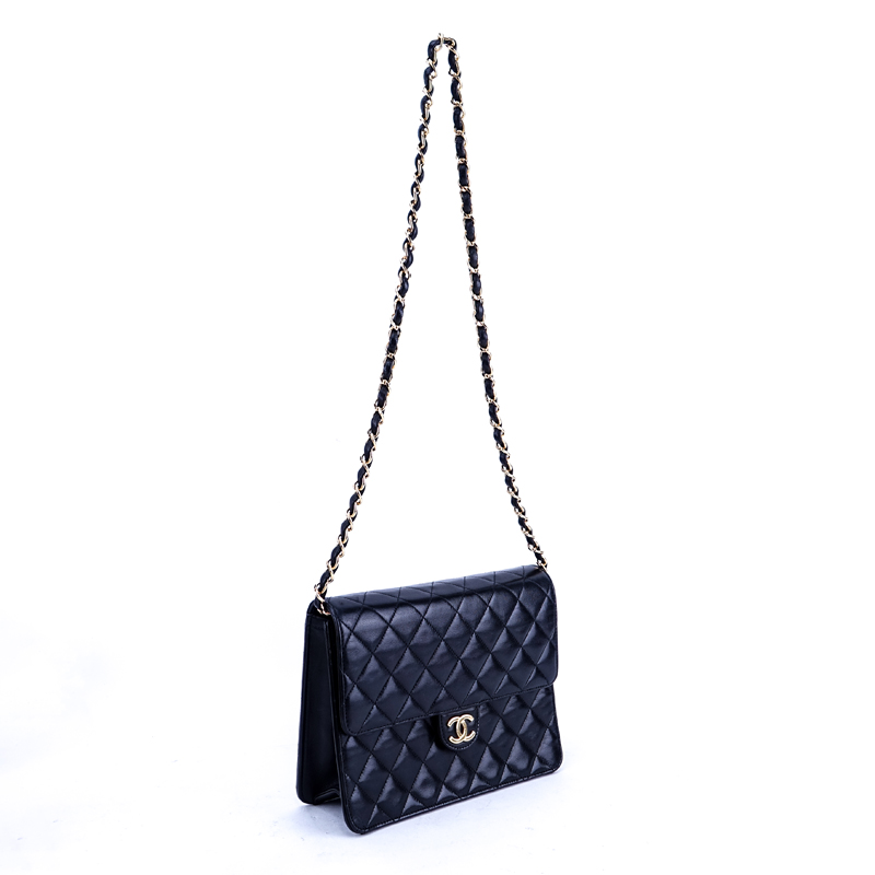 Chanel Black Quilted Leather Mademoiselle PM Handbag. Gold tone hardware.