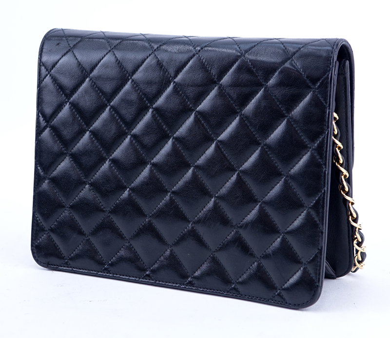 Chanel Black Quilted Leather Mademoiselle PM Handbag. Gold tone hardware.