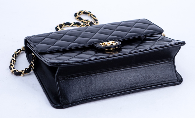 Chanel Black Quilted Leather Mademoiselle PM Handbag. Gold tone hardware.