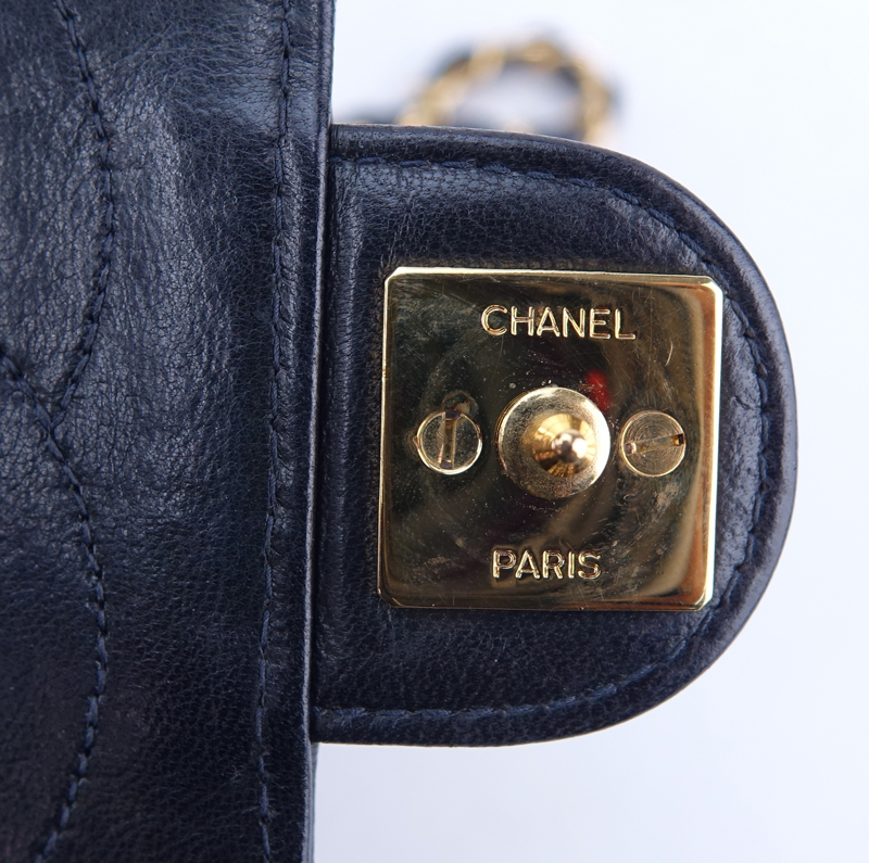 Chanel Black Quilted Leather Mademoiselle PM Handbag. Gold tone hardware.