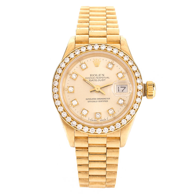 Lady's Rolex Presidential 18 Karat Yellow Gold Bracelet Watch with Factory Diamond Bezel and Hour Makers.