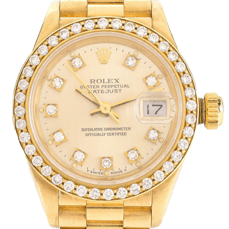 Lady's Rolex Presidential 18 Karat Yellow Gold Bracelet Watch with Factory Diamond Bezel and Hour Makers.