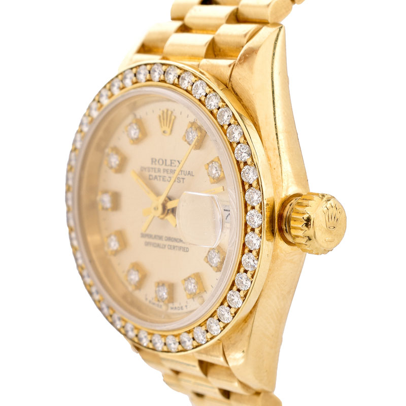 Lady's Rolex Presidential 18 Karat Yellow Gold Bracelet Watch with Factory Diamond Bezel and Hour Makers.