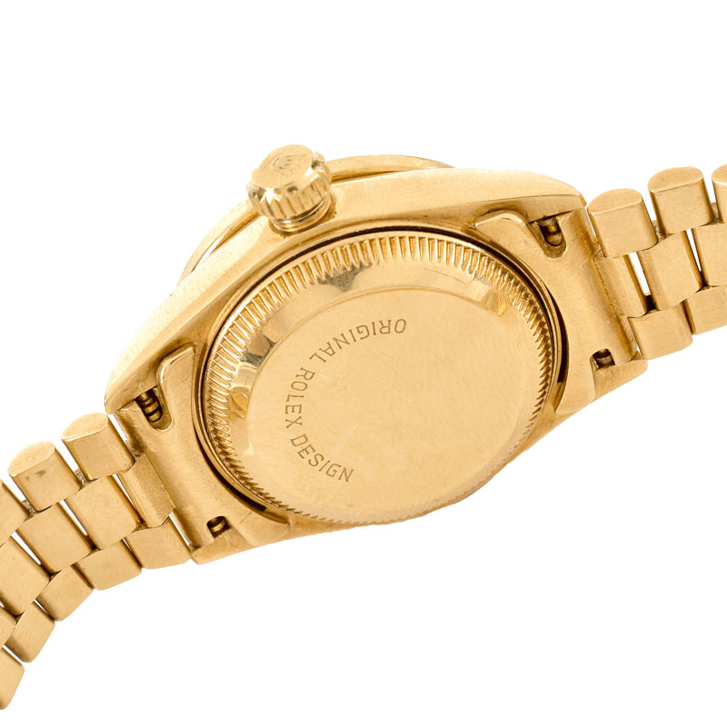 Lady's Rolex Presidential 18 Karat Yellow Gold Bracelet Watch with Factory Diamond Bezel and Hour Makers.