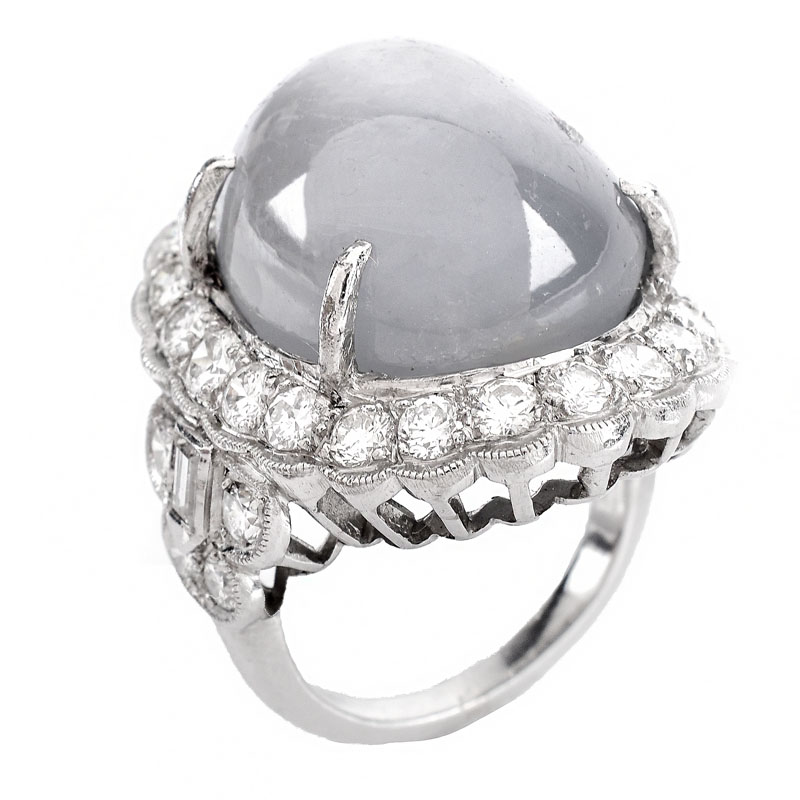 Lady's Vintage 34.24 Carat Oval Cabochon Star Sapphire, 2.70 Carat Round Brilliant Cut Diamond and Platinum Ring.