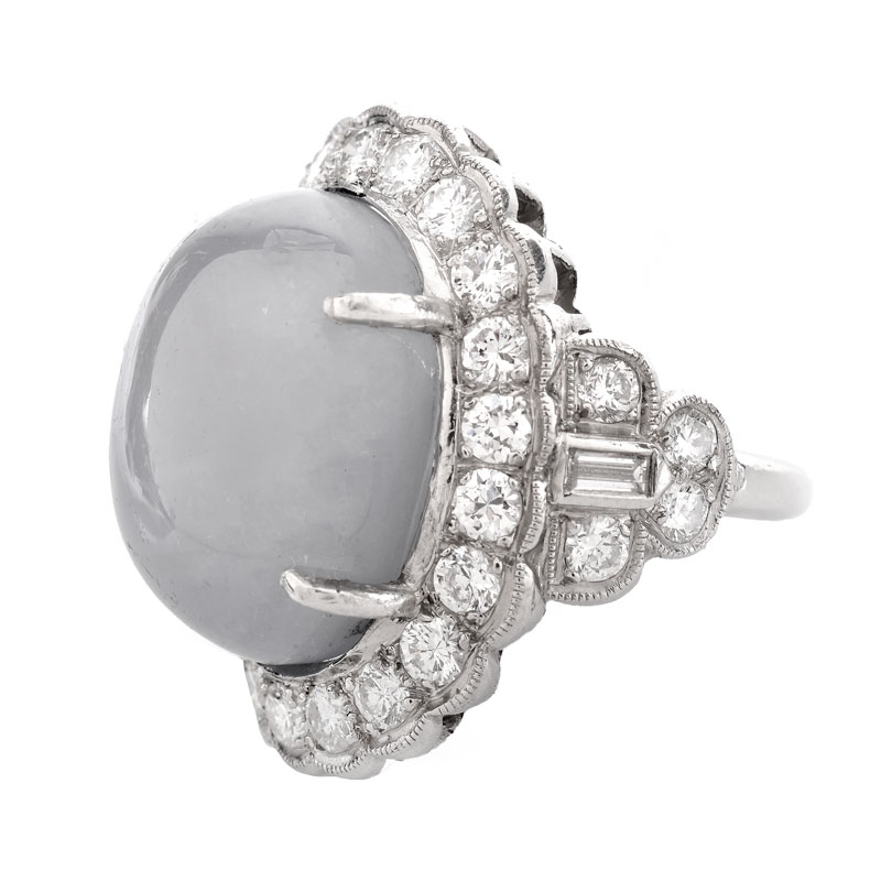 Lady's Vintage 34.24 Carat Oval Cabochon Star Sapphire, 2.70 Carat Round Brilliant Cut Diamond and Platinum Ring.