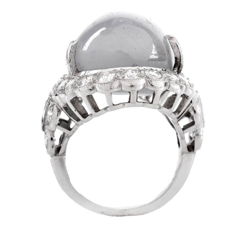 Lady's Vintage 34.24 Carat Oval Cabochon Star Sapphire, 2.70 Carat Round Brilliant Cut Diamond and Platinum Ring.