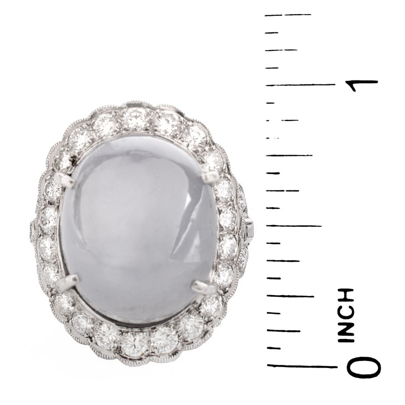 Lady's Vintage 34.24 Carat Oval Cabochon Star Sapphire, 2.70 Carat Round Brilliant Cut Diamond and Platinum Ring.