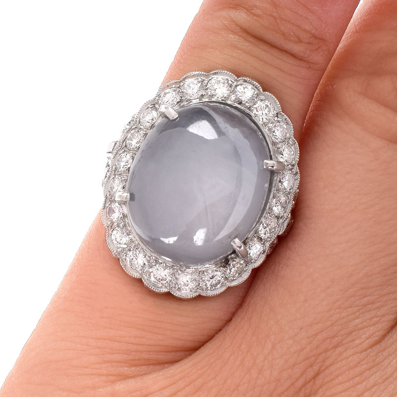 Lady's Vintage 34.24 Carat Oval Cabochon Star Sapphire, 2.70 Carat Round Brilliant Cut Diamond and Platinum Ring.